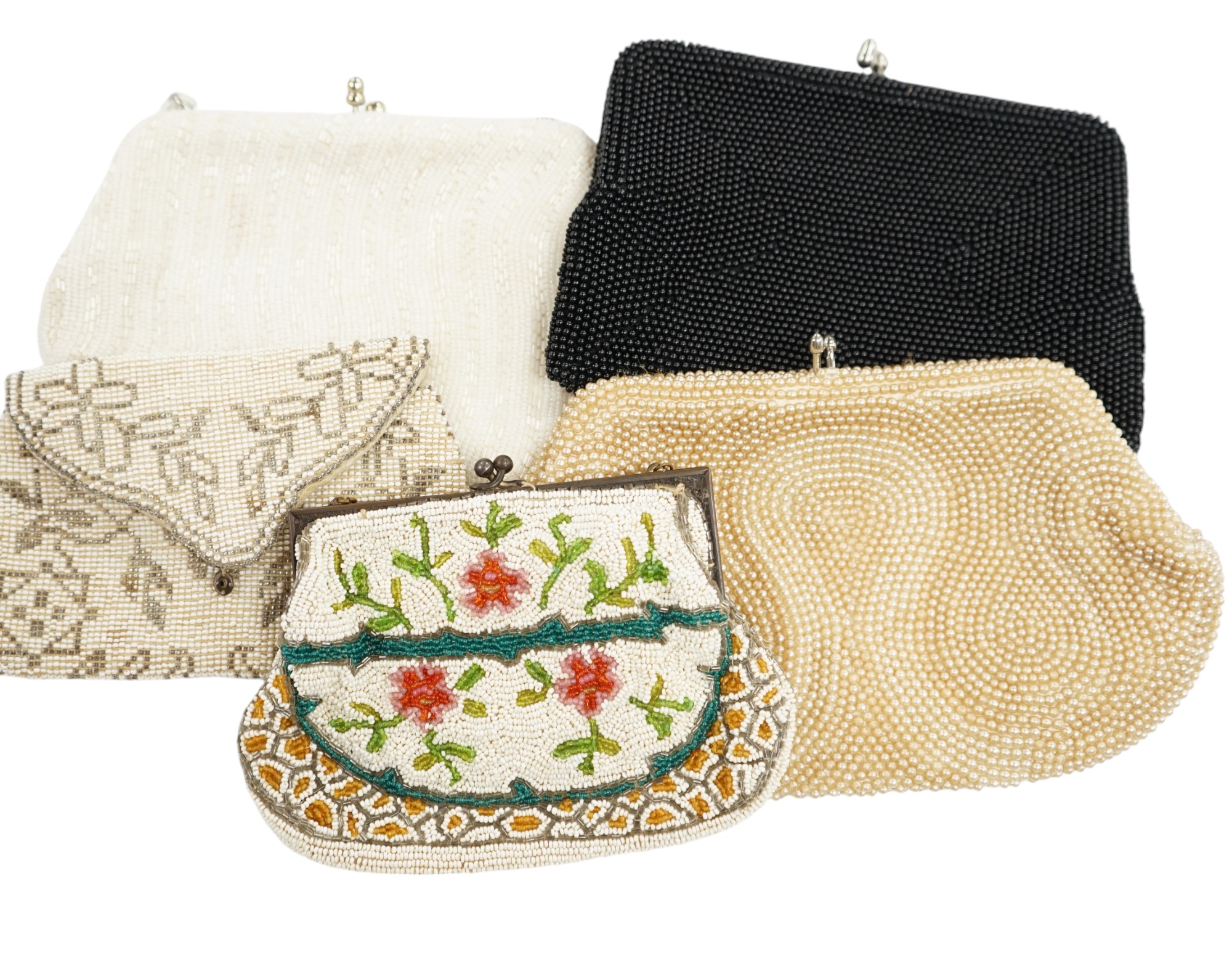 A collection of 1940’s-50’s beaded evening bags and clutch bags, largest 19cm high (9). Condition - exterior good, a few interiors of bags marked from use